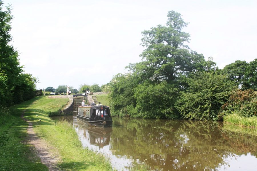 Narrowboat descending the 12 Bosley Locks on the Macclesfield Canal